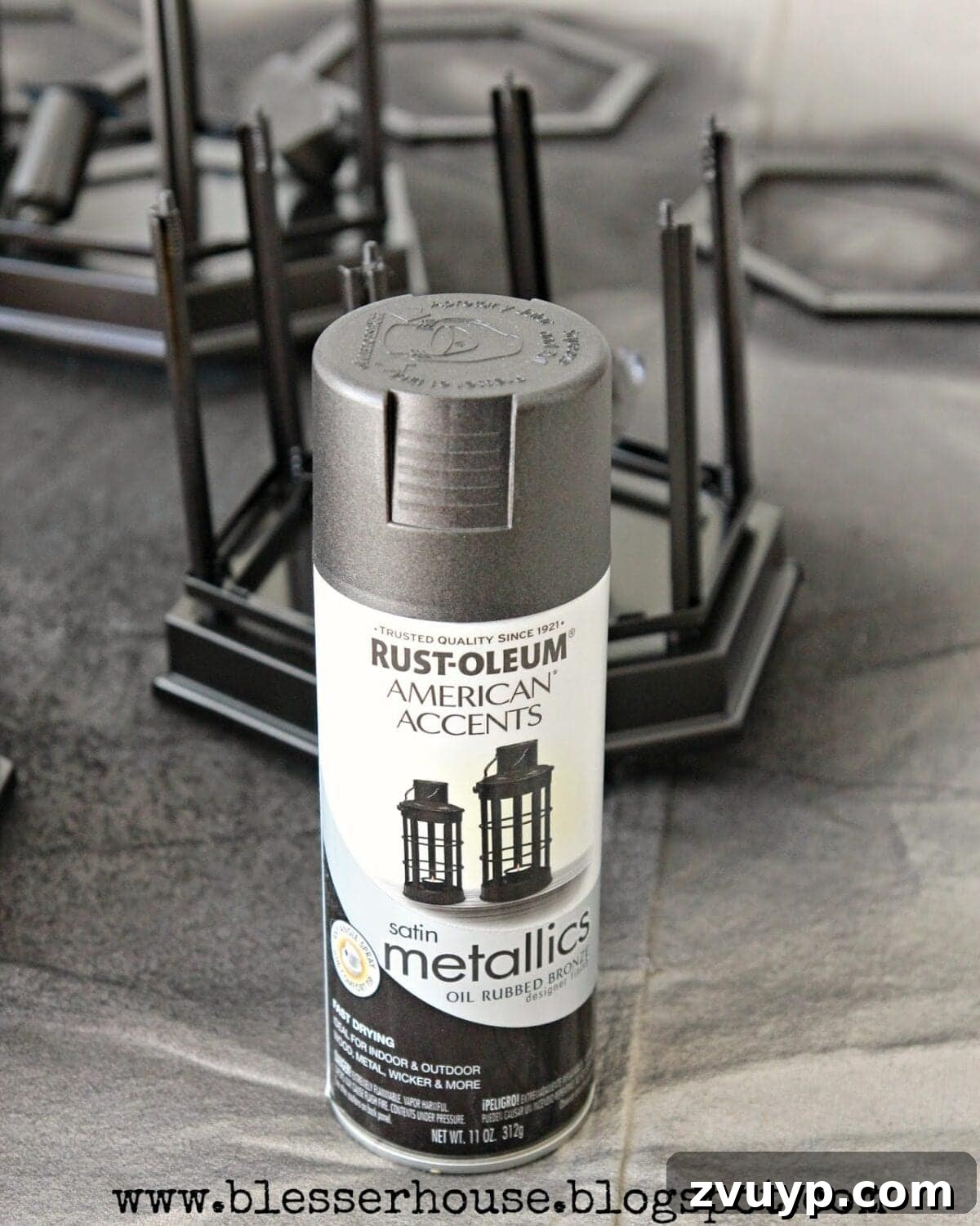 Bathroom light fixture spray painted in oil-rubbed bronze, drying