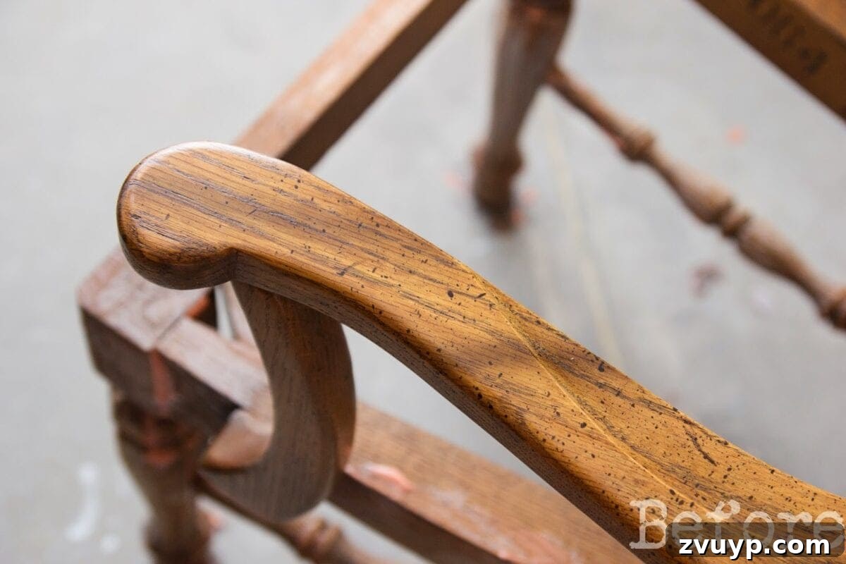 Mastering Citristrip Residue Removal from Wood Furniture 5 Before using denatured alcohol, showing a chair with stubborn, sticky wood stain and varnish residue that is difficult to remove.