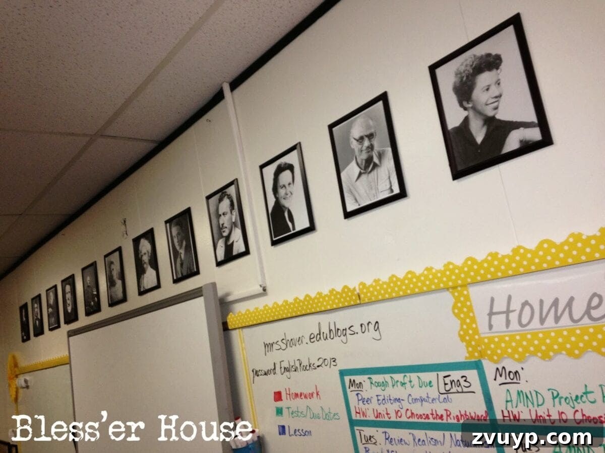 A close-up of the 'Author Wall,' featuring framed black and white portraits of various literary authors.