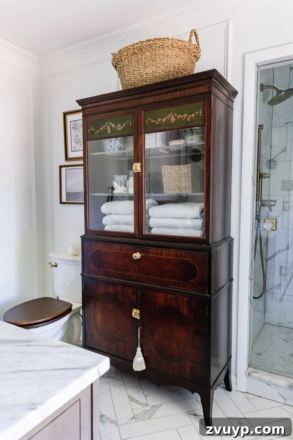 Secretary Desk Transformation: DIY Makeup Vanity for Small Bathrooms 2 Vintage Secretary Desk repurposed as a chic makeup vanity in a small bathroom, offering hidden storage and a sit-down spot for beauty routines.