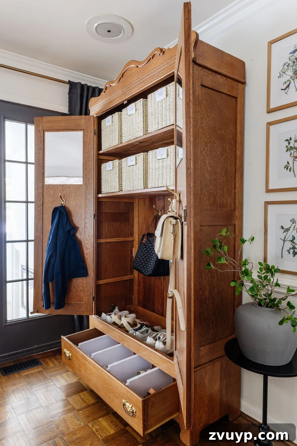 Stylish Storage Solutions That Work in Real Homes 6 armoire coat closet in an entryway for storage without a mudroom
