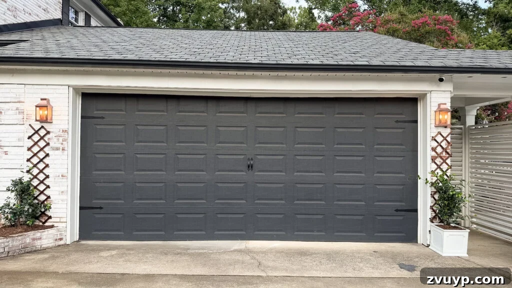 garage curb appeal with copper lanterns, star jasmine, and outdoor trash can hiding panels